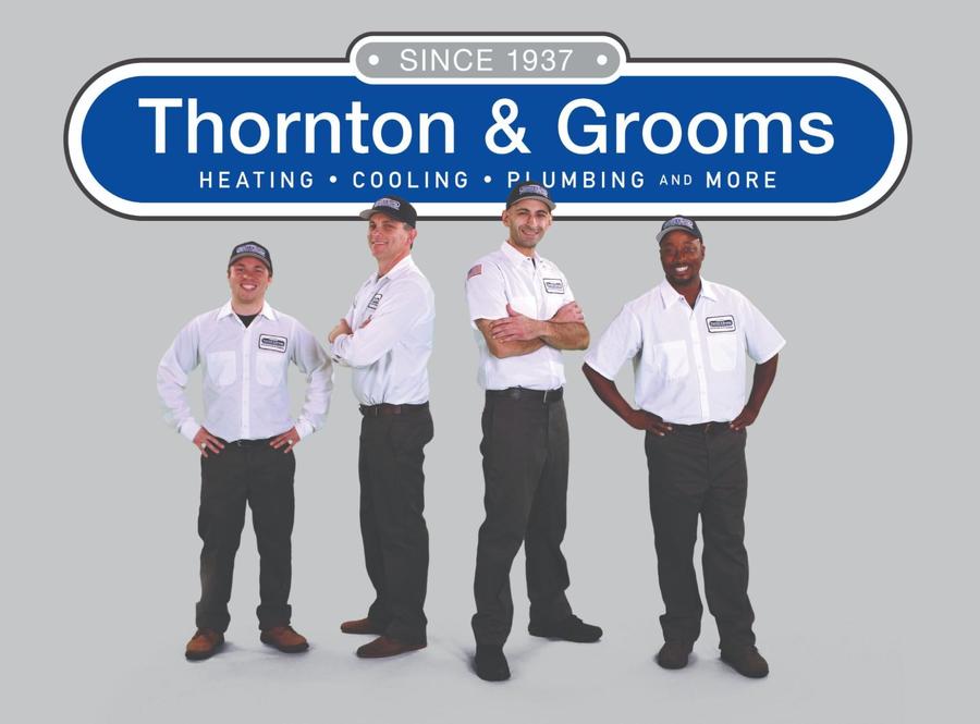 Thornton & Grooms technicians wearing branded button-up shirts and hats