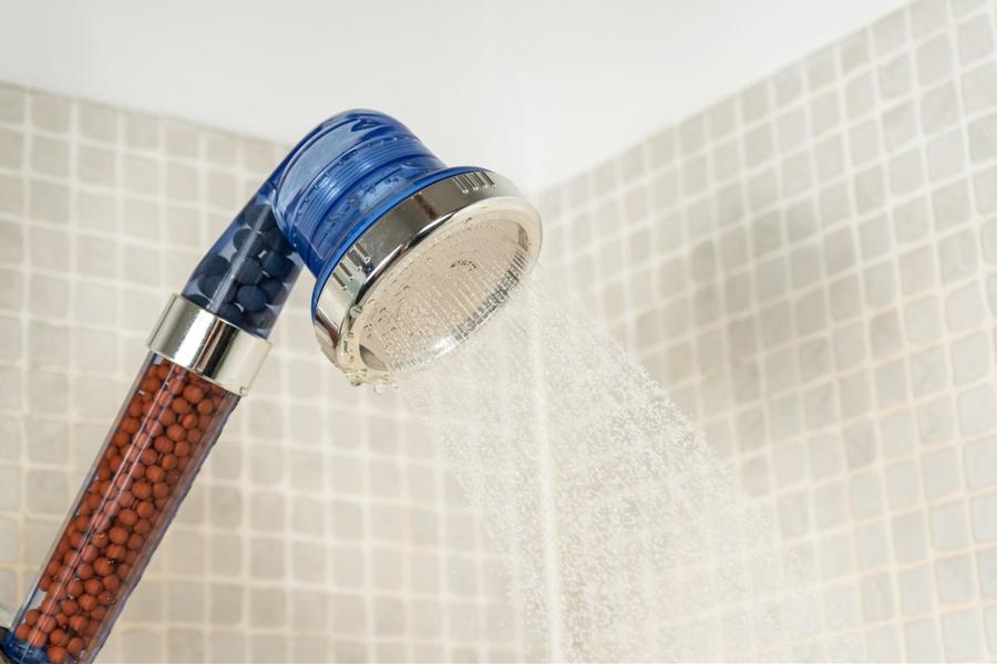 Blue and silver showerhead with an ionic filter